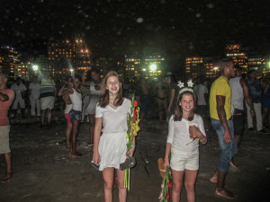 The girls with ceremonial flowers they are about to throw in the Atlantic.